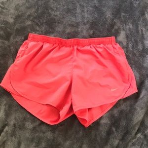 Neon pink Nike dri fit running shorts